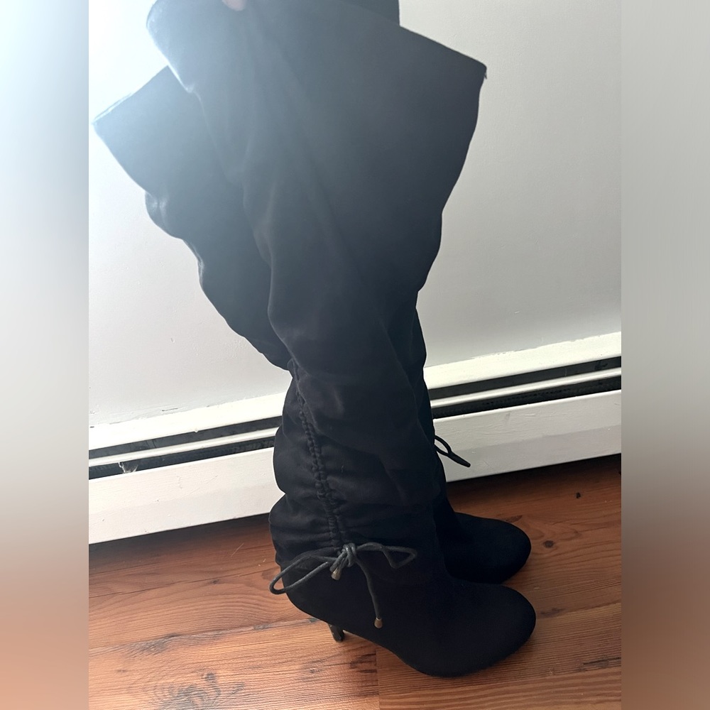 Black sued slouch over the knee boots.